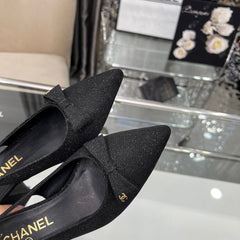 CHANEL 25S SANDALS WITH A BOW 60MM IN SPARKLING BLACK CANVAS