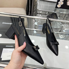 CHANEL 25S SANDALS WITH A BOW 60MM IN BLACK CALFSKIN