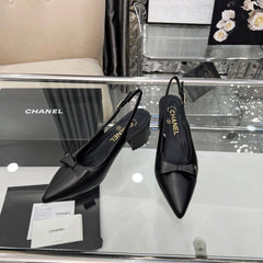 CHANEL 25S SANDALS WITH A BOW 60MM IN BLACK CALFSKIN