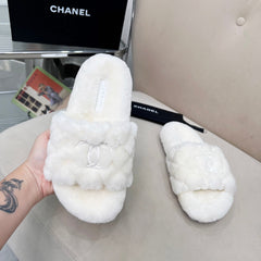 CHANEL 25S FUR SLIPPERS WITH EXPOSED-STITCH STRAPS IN WHITE