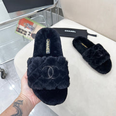 CHANEL 25S FUR SLIPPERS WITH EXPOSED-STITCH STRAPS IN BLACK