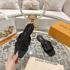 ISOLA FLAT SLIDE IN BLACK CALFSKIN