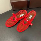 ALAIA BALLET FLATS IN CHERRY RED MESH FISHNET