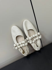 ALAIA SPHERE BALLET FLATS IN WHITE LAMBSKIN