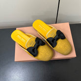 BOW MULES IN DUST YELLOW SUEDE