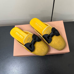 BOW MULES IN DUST YELLOW SUEDE