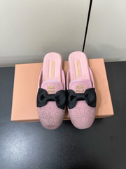 BOW MULES IN DUST PINK SUEDE