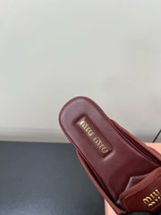 BOW MULES IN RED BROWN SHEEPSKIN