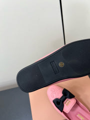 BOW MULES IN PINK SHEEPSKIN