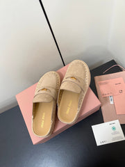 MULES SLIPPERS IN BEIGE SUEDE WITH GOLD COIN