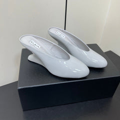 ALAIA WEDGE MULES 25S IN WHITE LAMBSKIN