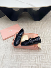 BOW MARY JANE FLAT IN BLACK NAPLAK LAMBSKIN