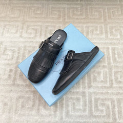 TASSEL MULES IN BLACK LAMBSKIN