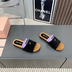 SLIPPERS IN BLACK SUEDE WITH PURPLE HALF-FOOT SOCKS