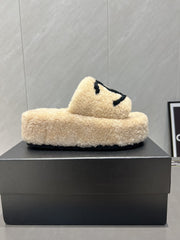 CHANEL 25S SLIPPERS THICK SOLED WITH EMBROIDERED LOGO IN BEIGE FUR