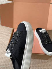 WASH SNEAKER MULES IN BLACK DENIM