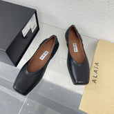 ALAIA BALLET FLATS IN BLACK CALFSKIN