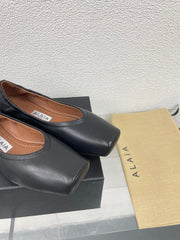 ALAIA BALLET FLATS IN BLACK CALFSKIN