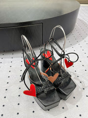 ALAIA BANQUET WEDGE SANDALS IN BLACK LAMBSKIN WITH RED HEART