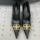 HEELED PUMPS 65 MM IN BLACK LIZARD PATTERN CALFSKIN GOLD HARDWARE