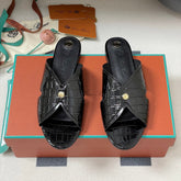 FLAT SLIPPERS IN BLACK CALFSKIN SNAKE EMBOSSING