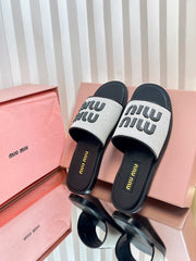 SLIDES SANDALS IN BLACK CALFSKIN AND WHITE STRAW WOVEN