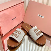 SLIDES SANDALS IN BROWN STRAW WOVEN