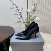 CURVED HEEL SHALLOW MOUTH PUMPS IN BLACK CALFSKIN