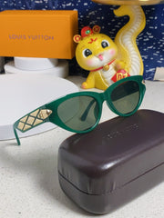 CAT EYE SUNGLASSES 576882 IN GREEN AND GOLD ACETATE