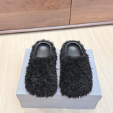 BALENCIAGA 25S MULES IN BLACK FAUX FUR