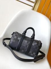 LV 25S KEEPALL BANDOULIÈRE 25 BAG IN DAMOFLAGE BLACK CALFSKIN