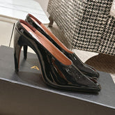 ALAIA SPIKE JEWEL MULES IN BLACK GLOSSY CALFSKIN