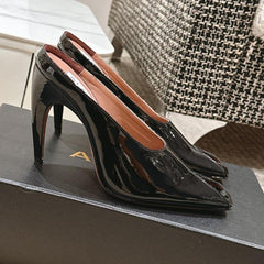 ALAIA SPIKE JEWEL MULES IN BLACK GLOSSY CALFSKIN