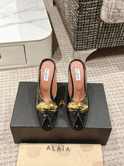 ALAIA SPIKE JEWEL MULES IN BLACK GLOSSY CALFSKIN WITH GOLD HARDWARE
