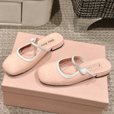 FLAT MULE IN PALE PINK PATENT CALFSKIN