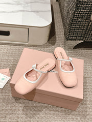 FLAT MULE IN PALE PINK PATENT CALFSKIN