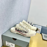 SNEAKER MULES IN WHITE CANVAS GRAFFITI LOGO