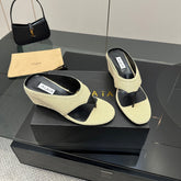 ALAIA WEDGE THONG SANDALS 25S IN LIGHT BEIGE RAFFIA