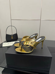 ALAIA HEELED THONG 25S IN GOLD PATENT LEATHER