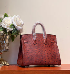 KELLY SELLIER 25 BAG IN BERRY RED OSTRICH LEATHER WITH GOLD HARDWARE