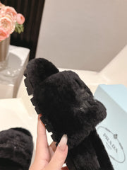 PRADA 25S FLAT MULES IN BLACK RABBIT FUR