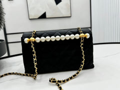 CHANEL 25S FLAP BAG 23 CM IN BLACK LAMBSKIN WITH PEARL TOP HANDLE
