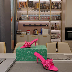 BOW-EMBELLISHED HIGH MULES IN HOT PINK SHEEPSKIN