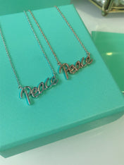 PEACE TEXT PEDANT NECKLACE