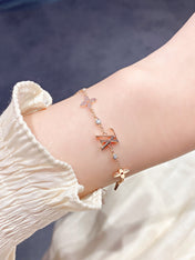 STAR AND SUN 7 MOTIFS GOLD BRACELET