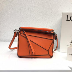 LOE MINI 18 PUZZLE BAG IN VIVID ORANGE CALFSKIN