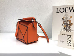 LOE MINI 18 PUZZLE BAG IN VIVID ORANGE CALFSKIN
