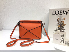 LOE MINI 18 PUZZLE BAG IN VIVID ORANGE CALFSKIN