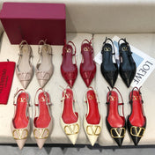 VLOGO SIGNATURE BLACK CALFSKIN FLAT SLINGBACK PUMP WITH GOLD LOGO