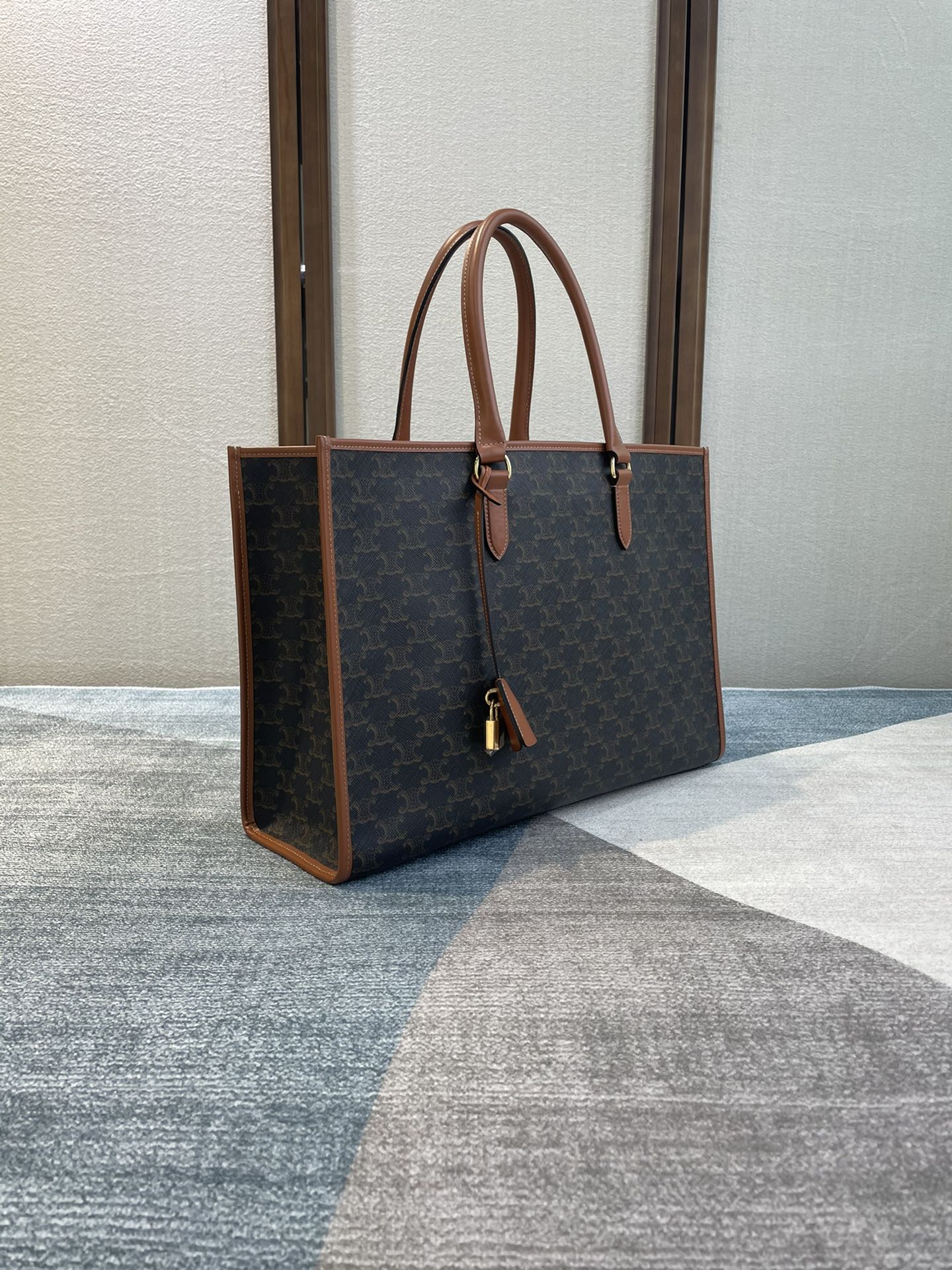 CELINE 25S HORIZONTAL CABAS 43MM IN BLACK TRIOMPHE CANVAS AND TAN BROWN CALFSKIN